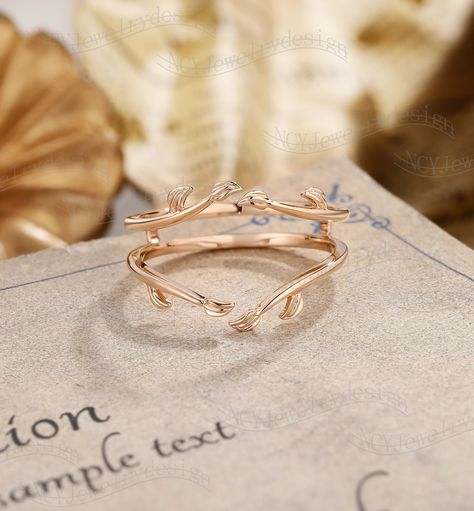 Wedding Band Details Leaf Wedding Band, Enhancer Wedding Band, Solid Rose Gold Ring, Branch Ring For Women, Wrap Ring, Plain Wedding Band, Stacking Wedding Band Ring#: NC16314 Plain Solid Gold Custom orders are most welcome! Please feel free to ask for any item, any adjustments or anything else you want me to make. Rush order Orders can be expedited for a fee. If your order needs to be expedited, please contact us ASAP. Layaway plan We offer layaway plan that works with a $100 as the first payment, and all payment plans have to be paid in FULL within 6 months after the first payment. How does it work: 1) Message us the link to your favorite ring，your finger size，the metal and how much you would like to do for the first payment. 2) We will set up your payment link and send it to you. 3) Aft Wrap Around Wedding Band, Whimsical Wedding Band, Curved Wedding Band For Oval Ring, Wedding Ring Leaf Band, Leafy Wedding Band, Plain Rose Gold Wedding Band For Women, Rose Gold Floral Wedding Band, Leaf Engraved Wedding Band, Gold Vine Wedding Band