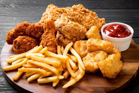 Fried chicken with french fries and nugg... | Premium Photo #Freepik #photo #chicken-nuggets #nuggets #fries #french-fry Chicken Fries, Chicken And Chips, Frozen Shrimp, Nigerian Food, Foods To Avoid, Food Platters, Fried Food, Food Safety, Food Obsession