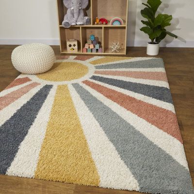 This unique collection of stunningly soft and cozy high-pile indoor rugs features a wide range of well-balanced designs; from modern organic lines, mid-century geometric shapes, and on-trend playful patterns to tribal-inspired drawings and primitive symbolic motifs... there's a rug to match every kind of interior design. Thanks to the high-quality, micro-set polypropylene yarn and the durable woven construction, these rugs are stain resistant, non-shedding, suitable for floor heating, and very e You Are My Sunshine Nursery Decor, Sunshine Nursery Theme Gender Neutral, You Are My Sunshine Nursery Theme, Playroom Rug Ideas, Sunshine Themed Nursery, Sunshine Nursery Theme, Muted Rainbow Nursery, Orange Playroom, Yellow Playroom