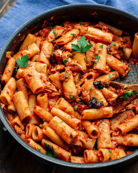 Pasta al tonno combines oil-packed yellowfin tuna, capers, olives, and anchovies in a simple tomato sauce that's simmered and tossed with al dente pasta. This one's so easy to make and comes together in about 30 minutes! #tunapasta #pastaaltonno #easypastarecipes Tuna Pasta Italian, Pasta With Tuna And Olives, Tuna Olive Pasta, Pasta With Tuna And Capers, Tuna Pasta Tomato Sauce, Olive Pasta Recipes, Tuna And Pasta, Pasta Tuna, Clam Sauce Recipe