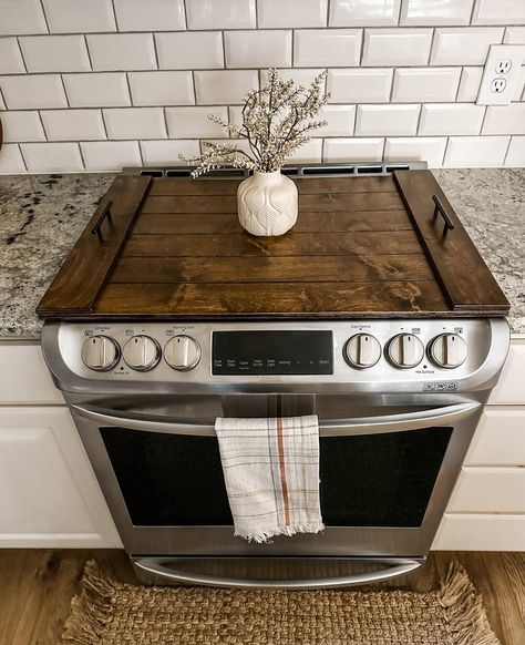 Items ordered AFTER 12/6/2023 ---MAY--- NOT--- ARRIVE--- by Christmas. 🔨If you need a custom size email us here ~ hello@josephinethomashome.com and include pics of your stove with a tape measure. We are happy to help! We are a small family-owned business and have our own website at josephinethomashome.com Stop in! Our handmade noodle boards are the perfect way to make better use of your stovetop. Although not food grade, these are definitely décor-grade :-) Use them to clean up the look of your stovetop or hold often-used spices or décor. This noodle board is stained in warm brown stain with a clear coat and laser carved to resemble individual slats.  Handles are added to each side. Measures: 30 x 22 x 1.5 inches 31 x 23 x 1.5 inches 37.5 x 23 x 1.5 inches Please measure your stovetop. 🖤 Stove Wood Cover, Stove Makeover Diy, Kitchen Stuff Household Items, Stove Cover Ideas, Oven Top Cover Wood, Electric Cooktop Cover, Simple Western Kitchen, Noodle Board Diy, Stovetop Cover Wood