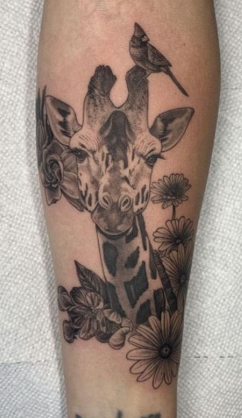 95 Unique Giraffe Tattoos, Ideas, & Meaning - Tattoo Me Now Giraffe Tattoo Watercolor, Giraffe And Flower Tattoo, Realistic Giraffe Tattoo, Giraffe Leg Tattoo, Safari Tattoo Ideas, Elephant And Giraffe Tattoo, Giraffe Tattoo With Flowers, Jungle Animal Tattoos, Giraffe Tattoos For Women