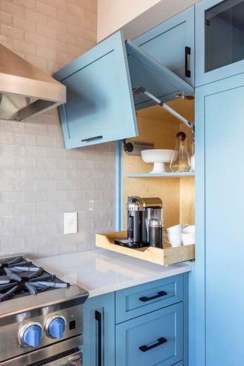 Say hello to smart storage solutions with this beautifully efficient corner kitchen cabinet! In a refreshing shade of blue, it opens up to reveal neatly organized essentials, making the most out of every precious square inch. ☕️🍽️ Perfect for tiny space dwellers who love a mix of functionality and style. Want more clever ideas for your kitchen corners? Click to uncover 15 space-savvy cabinet concepts on our blog! 📌 #GoTinySpace #CornerKitchenCabinetIdeas #SmallKitchenSolutions Dated Kitchen, Dark And Gloomy, Grey Wall Tiles, Appliance Garage, Kabinet Dapur, Bob Vila, Blue Cabinets, Dark Kitchen Cabinets, Garage Ideas