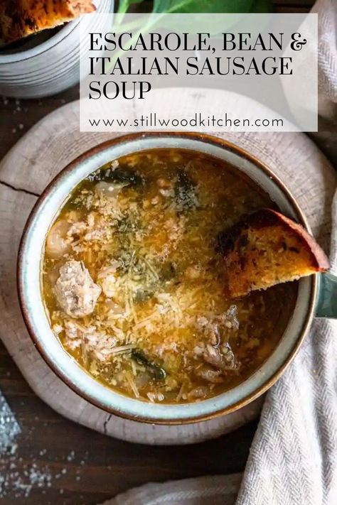 Soup in a mug with cheese sprinkled on top and a slice of garlic bread peaking out of the side. Sausage And Escarole Soup, Sausage Escarole And Bean Soup, Escarole And Beans With Sausage, Escarole Soup, Bean And Sausage Soup, Italian Sausage Soup, Comforting Soup, Summer Soup, Spinach Soup