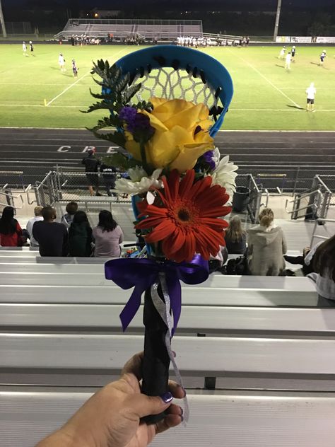 Lacrosse Bouquets for Senior Moms on Senior Night Lacrosse sticks were purchased at Academy Sports in the pool toys section Lacrosse Team Party Ideas, Lacrosse Stick Flower Bouquet, Senior Day Decorations Sports, Lacrosse Bouquet, Lacrosse Senior Night Gifts, Lacrosse Graduation Party Ideas, Lacrosse Senior Night Posters, Senior Night Flowers For Mom, Senior Night Gift Ideas Lacrosse