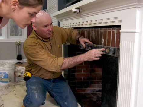 How to Tile Over a Brick Fireplace - This Old House Tile Over Brick Fireplace, Fireplace Upgrade, Tile Around Fireplace, Stone Veneer Fireplace, How To Tile, Fireplace Redo, Fireplace Pictures, Tile Fireplace, Fireplace Tile Surround