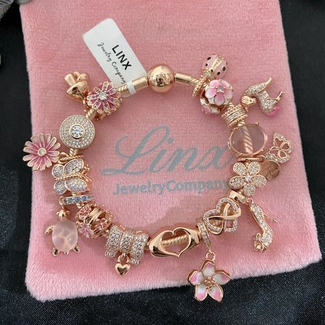 Linx Snake Chain Style Charm Bracelet With A Ball Clasp, Featuring Linx Logo. The Bracelet Comes With 18 Linx Charms As Shown. *All Items Are 925 Sterling Silver And 18k Rose Gold Over 925 Sterling Silver. *Linx Bracelets And Charms Are Very Well Made And Of Superior Quality, Designed To Last. These Pieces Come With A 100% Satisfaction Guarantee Or Your Money Back. *The Bracelet Is Available In Multiple Sizes *Additional Charms Can Also Be Added To The Bracelet And The Ones Included Are Removabl Linx Bracelets, Girl Things To Buy, Rose Gold Pandora Charms, Charmed Bracelet, Bracelets For Girls, Rose Gold Pandora Bracelet, Charm Bracelet Gold, Items To Buy, Cute Jewelry Aesthetic