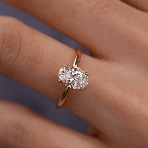 Our 1.60 carat oval diamond yellow gold solitaire engagement ring. This timeless piece features a dazzling oval-cut diamond set in warm yellow gold in the classic Chelsea solitaire style. Ethically sourced and meticulously crafted, it’s a symbol of both enduring commitment and sustainability. Celebrate your love with the brilliance of this exquisite ring, marrying modern elegance with conscious choices. Handcrafted in Hatton Garden, London Wedding Rings Engagement Oval Gold, Yellow Gold Vintage Engagement Ring, Yellow Gold Engagement Ring Oval, Yellow Gold Solitaire Engagement Ring, Ring Cuts, Stacked Wedding Rings, Gold Solitaire Engagement Ring, Statement Rings Diamond, Future Engagement Rings