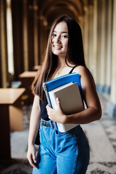 Confident asian student holding books an... | Free Photo #Freepik #freephoto #books #computer #education #woman Hold Book Reference, College Student Photo, Pose With Book Reference, Student Portrait Photography, Carrying Books Pose, Person Holding Book Reference Drawing, Holding Books Reference, Holding Books Pose, Student Pose Reference