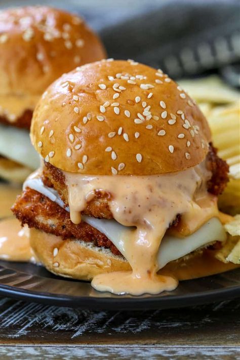 These Bang Bang Chicken Sliders are the ultimate party food! Crispy chicken cutlets with an addicting Bang Bang Sauce and mozzarella cheese! Best Easy Meals, Effortless Dinner Ideas, Crispy Chicken Sliders Recipes, Chicken Patty Sliders, Spicy Sliders Recipes, Chicken Cutlet Sliders, Breaded Chicken Sliders, Fried Chicken Sliders Recipes, Crispy Chicken Sandwich Ideas