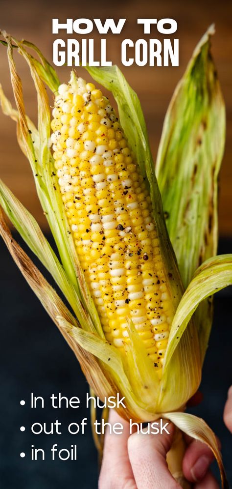 A hand holding an ear of corn with the husk partially removed. Bbq Corn On The Cob In Husk, Corn On The Grill In Husk, Grill Corn On The Cob In Husk, Grilled Corn On The Cob In Husk, How To Grill Corn On The Cob, Grill Corn In Husk, Bbq Corn On The Cob, How To Grill Corn, Grill Corn On The Cob