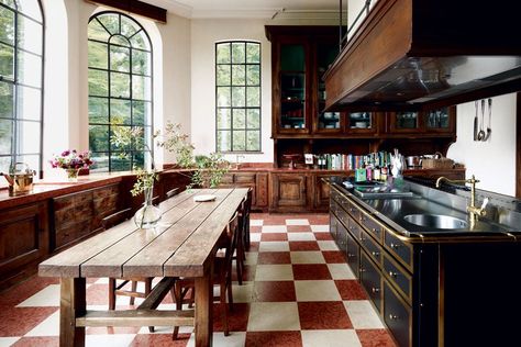 The kitchen of a Belgian château by Axel Vervoordt Walnut Kitchen Dark Countertop, Architectural Digest Wallpaper, Red And Wood Kitchen, Wood On Wood Kitchen, Axel Vervoordt Kitchen, Architectural Digest Dining Room, Black And Wood Interior Design, Red Wood Kitchen, Vervoordt Axel