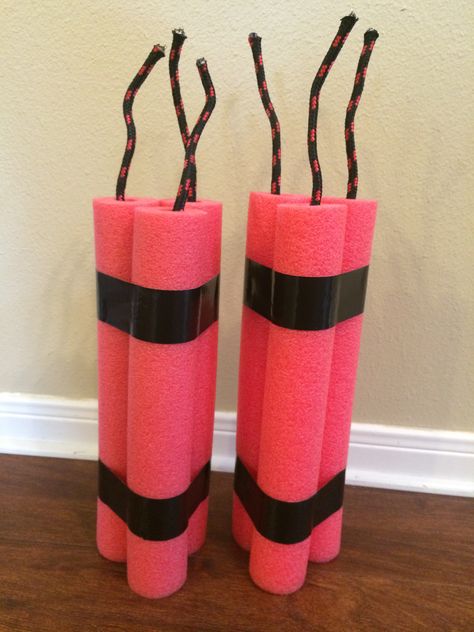 Pool noodle TNT. Cut pool noodle into thirds. Use black duct tape to tape together. Fuses are rope from Walmart, duct taped inside pool noodle. Pool Noodle Dynamite, Mining Party Decorations, Minecraft Pool Party Ideas, Fortnite Pool Party Ideas, Fortnite Diy Decorations, Dynamite Birthday Party, Minecraft Props, Diy Western Party Decorations, Army Decorations