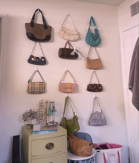 purse wall, room decor, purse display, purses, wall art Handbags On The Wall, Handbags On Wall, Purses On Wall Aesthetic, Bedroom Handbag Display, Room Purse Display, Purse Hanging Ideas Bedrooms, Creative Purse Display, Bag Hooks Wall, How To Hang Purses