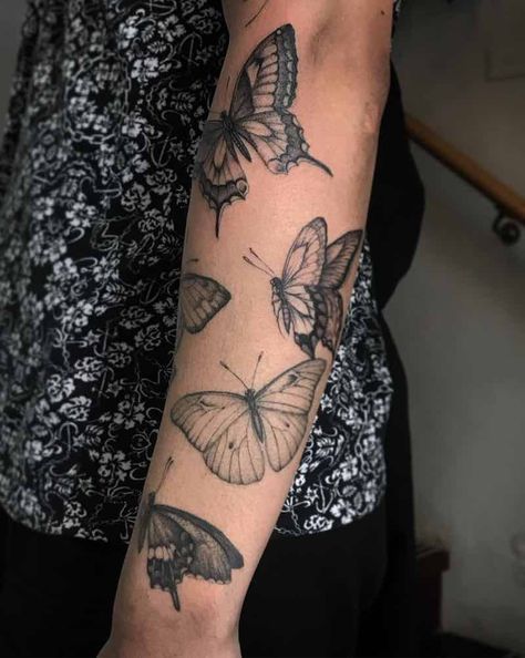 Butterfly Tattoos by Ed Taemets Butterfly Tattoo On Sleeve, Sleeve Of Butterflies Tattoo, Negative Butterfly Tattoo, Butterfly Fill In Tattoo, Butterfly Collage Tattoo, Pinned Butterfly Tattoo, Nature Butterfly Tattoo, Butterfly Cluster Tattoo, Butterfly Tattoo Half Sleeve