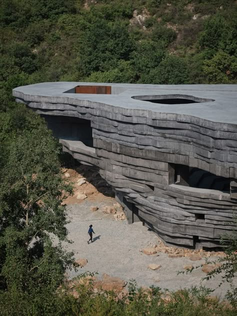 Open Architecture unveils rock-like concert hall in a valley outside Beijing Layered Architecture, Roskilde Festival, Open Architecture, Outdoor Stage, Dune Art, Concrete Architecture, Concrete Building, Outdoor Concert, Houses Architecture