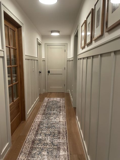 Wood And White Hallway, Hallway Wallpaper Inspiration, Colonial House Update, Hallway Decorating Ideas Wall, Craftsman Hallway Ideas, Narrow Hallway With Doors, Old Farmhouse Hallway, Entryway To Basement Stairs, Half Wall Foyer