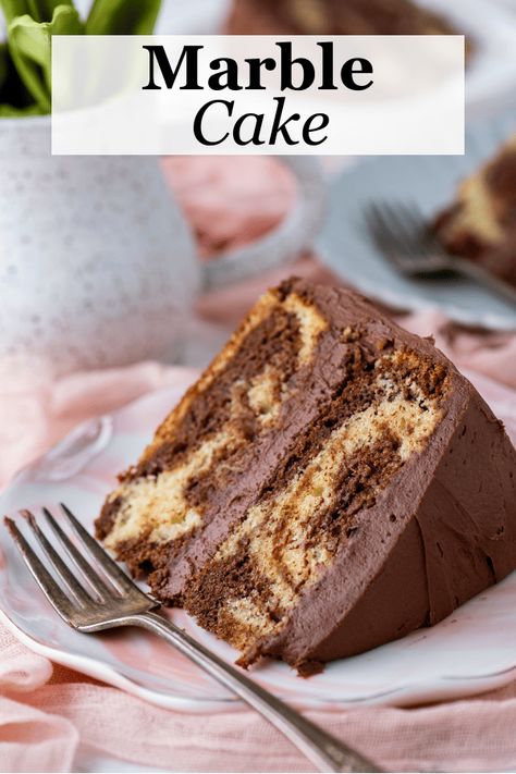 This homemade marble cake rivals any bakery and is incredibly easy to make. With just 15 minutes of prep time, this cake pairs vanilla and chocolate cake in a gorgeous swirl that is sure to impress and tastes as good as it looks. Best Marble Cake Recipe, Homemade Marble Cake, Vanilla And Chocolate Cake, Marble Cake Recipe, Chocolate And Vanilla Cake, Cookie Cookbook, Bakery Style Muffins, Cake Plates Stand, Best Chocolate Cake