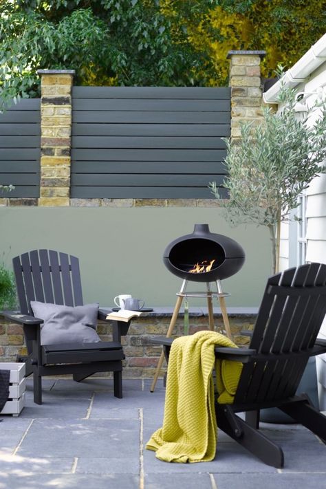 Ready for those long summer evenings relaxing by the fire? Sandtex 10 Year Exterior Satin instantly refreshes tired exterior furniture and fencing, perfect for creating a welcoming space to relax and recover. 🎨Wall: Sandtex Ultra Smooth Microseal Masonry Paint in Olive. Fence: Sandtex 10 Year Exterior Satin in Seclusion. Chairs: Sandtex 10 Year Satin paint in Black. #garden #alrescodining #outdoorseating #diy #outdoorpaint #gardeninspiration #homestyle #painting #gardenrenovations #sandtex Sandtex Masonry Paint, Exterior Wood Paint, Masonry Paint, Outdoor Projector, Wood Shades, Exterior Wood, Festoon Lighting, Chaise Design, Interior Garden