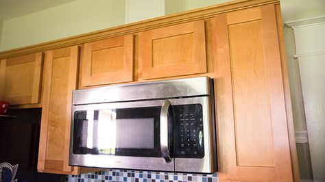 Many times an over-the-range microwave that recirculates cooking fumes can be converted to exhaust to the outside. Here's how to go about it. Over Range Microwave, Otr Microwave, Stove Vent, Vent Duct, Kitchen Vent, Kitchen Exhaust, Hood Vent, Build A Frame, Exhaust Vent