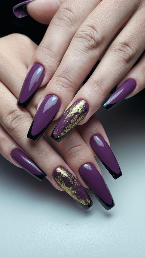 Transform your manicure into a royal affair with these gorgeous purple acrylic nails adorned with shimmering gold and sleek black tips! The rich purple hue catches the light beautifully, while the touch of gold shimmer adds a luxe finish. Perfect for special occasions or whenever you want to feel glamorous, these nails are a stunning blend of sophistication and creativity. #nailsdesign #acrylicnails #septembernails #autumnnails #fallnails Dark Purple And Gold Nails, Gold And Purple Nails, Purple And Gold Nails, Gold Coffin Nails, Black Acrylic Nail Designs, Dark Purple Nails, A Royal Affair, Black Tips, Purple Acrylic Nails