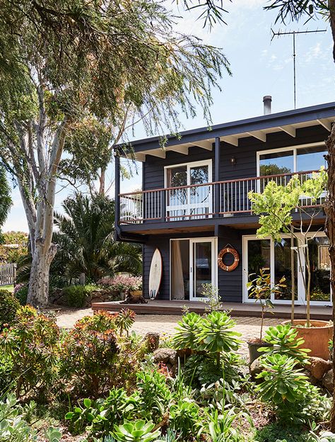 Urban Beach House, Coastal Beach Shack, Coastal Shack Exterior, Black Beach House Exterior, Apartment By The Beach, Colourful Beach House, Wooden Beach House Exterior, Dark Blue Beach House Exterior, Beach Apartments Exterior