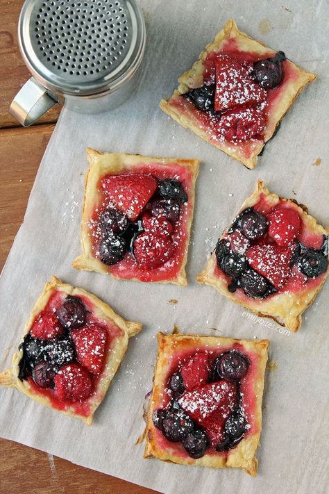 These Mixed Berry Puff Pastry Tarts are the perfect just-sweet-enough dessert for summer! Flaky, juicy, and just 99 calories or 3 Weight Watchers Freestyle SmartPoints each! www.emilybites.com Leftover Puff Pastry, Berry Puff Pastry, Puff Pastry Tarts, Puff Pastry Recipes Dessert, Emily Bites, Pastries Recipes Dessert, Puff Pastry Tart, Ww Desserts, Frozen Puff Pastry