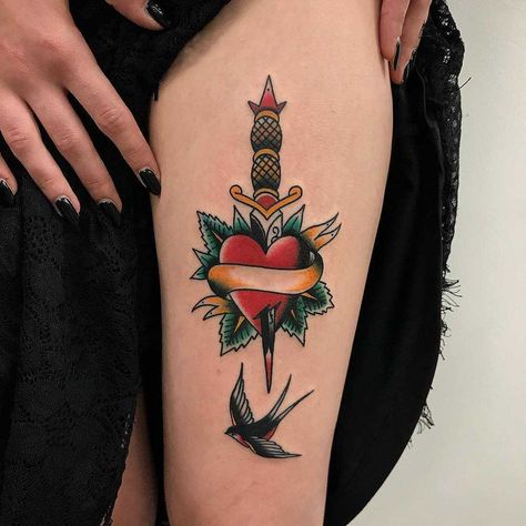 Traditional heart, dagger, and swallow tattoo on the left thigh by Łukasz Krupiński Dagger Thigh Tattoo, Heart With Dagger Tattoo, Heart And Dagger Tattoo, Tattoos Bear, Knife Tattoos, Heart Dagger Tattoo, Heart Knife, Traditional Heart Tattoos, Tattoos Heart