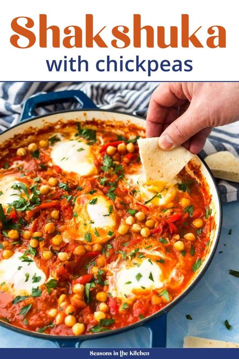 Shakshuka Recipe - A flavorful dish where eggs are poached in a rich tomato sauce with chickpeas, red peppers, and Moroccan spices. Serve with warm pita for a perfect brunch or breakfast. Pop over to our site for the full recipe! Drinks With Wine, Shakshuka Recipe, Shakshuka Recipes, East Recipes, Sweet Morning, Middle East Recipes, Sauce For Rice, The Kitchen Recipes, Moroccan Spices