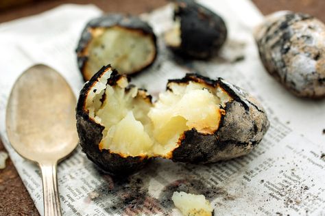 You don’t need a real recipe for these potatoes, but you do need a charcoal grill because these ash-baked tubers won’t work with gas. (Photo: Andrew Scrivani for The New York Times) Baking Potatoes, Campfire Recipes, Hot Snacks, Bad Carbohydrates, Nyt Cooking, Fire Roasted, Grilled Vegetables, Roasted Potatoes, Charcoal Grill