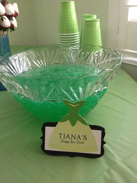 Tiana's Froggy Green Punch.  Menu for a Disney Princess Bridal Shower We threw for my friend. Table tents made with the circut. Princess Party Punch, Tiana Food Ideas, Disney Princess Themed Bridal Shower Ideas, Princess Tiana Party Food, Princess Tiana Birthday Party Food, Princess And The Frog Bridal Shower Ideas, Princess And The Frog Party Games, Princess And The Frog Treat Table, Princess And The Frog Themed Food