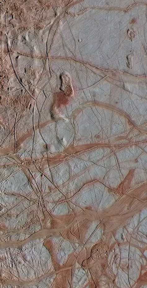 This enhanced-color view obtained on September 25, 1998 from NASA's Galileo spacecraft shows an intricate pattern of linear fractures on the icy surface of Jupiter's moon Europa. Moon Universe, Jupiter Moons, Moon Surface, Nasa Missions, Planets And Moons, Nasa Jpl, Look At The Moon, Universe Galaxy, Space Photos