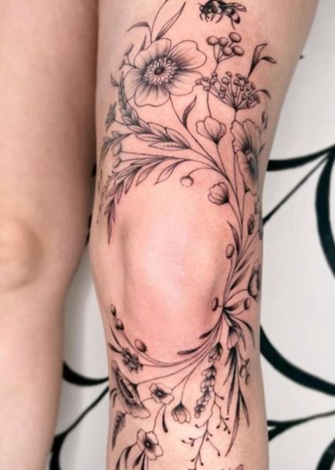 19 Flower Tattoos That'll Live Forever - Let's Eat Cake Wild Flower Tattoo Leg Sleeve, Knee Tattoo Design For Women, Flower Pot Ankle Tattoo, Botanical Calf Tattoo, Around The Knee Floral Tattoo, Flower Tattoos On Legs For Women, Nature Calf Tattoo, Knee Wrap Tattoos Women, Around Knee Cap Tattoos Women