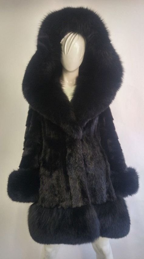 BEAUTIFUL & VERY STYLISH BLACK MINK FUR COAT FOR WOMEN MADE FROM FULLY LET OUT SKINS! THE HOOD IS FIXED AND COMPLETED WITH BRAND NEW BLACK FOX FUR TRIM. ALSO FOX FURS AT CUFFS, BOTTOM OF THE COAT AND INSIDE THE HOOD. IT CLOSES WITH FRONT HOOK & EYE CLOSURES AND HAS TWO SIDE POCKETS. THIS COAT IS REFURBISHED NEW, MADE TO MEASUREMENT. AFTER BUYING THIS ITEM, IT WOULD BE VERY MUCH APPRECIATED IF YOU COULD PROVIDE YOUR HEIGHT, WEIGHT AND BUST CIRCUMFERENCE, SO WE CAN MAKE THE COAT TO YOUR SIZE.  MEA Fox Fur Jacket, Black Fox, Mink Fur Coat, Coat For Women, Fox Fur Coat, Swaggy Outfits, Mink Fur, Hook Eye, Dream Clothes