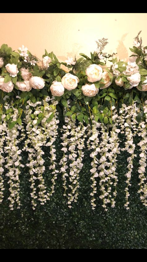 Wisteria Vines and peonies make this boxwood backdrop come to life! Rent it at MariellaParties.com Wisteria Wedding Backdrop, Green Wall Wedding Backdrop With Lights, Wisteria Backdrop, Wisteria Wedding Colors, Flower Wall Background Greenery, Floral Wall Backdrop Greenery Wallpaper, Flower Wall White And Green, Wisteria How To Grow, Purple Wisteria Photo Backdrop