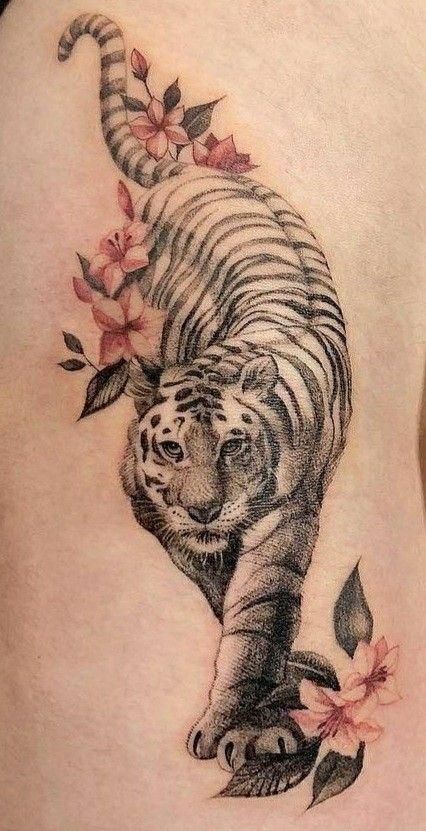 21 Spiritual Protection Tattoo Ideas You'll LOVE - Spirithandbook Flower Tattoos For Women Arm, Protection Tattoo Ideas, Small Lion Tattoo For Women, Tattoos For Women Arm, Tiger Lily Tattoo, Tiger Tattoo Thigh, Tiger Tattoo Designs, White Tiger Tattoo, Flower Tattoos For Women