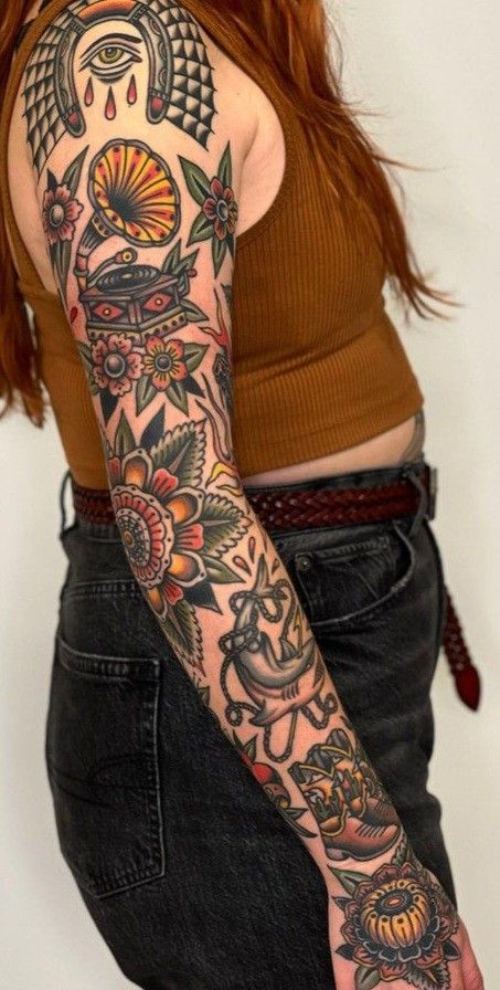 American Style Sleeve Tattoo, Neotraditional Patchwork Tattoo, American Traditional Tattoos Arm Sleeve, American Traditional Lilly Tattoo, Old School Sleeve Women, Traditional Tattoo Arm Sleeve Women, Traditional Style Filler Tattoo, Women Chest Tattoo Traditional, Tattoo Sleeve Women Traditional