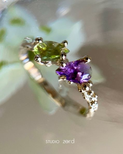 A truly romantic masterpiece: the Toi et Moi ring! Handcrafted in 14k yellow gold, featuring a 6×4mm amethyst paired with a vibrant green 6x4mm peridot. Celebrate love with every glance✨🤍 Ruby And Peridot Rings, Amethyst And Peridot Engagement Ring, Amethyst Toi Et Moi Ring, Elegant Gold Multi-stone Amethyst Ring, 14k Gold Multi-stone Amethyst Promise Ring, Celebrate Love, Vibrant Green, Amethyst, Yellow Gold