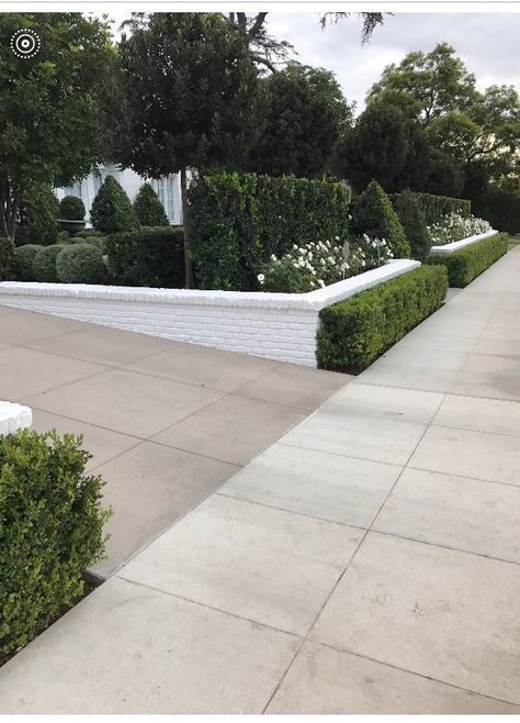 Retaining Wall On Driveway, Brick Landscape Wall, Driveways With Retaining Walls, Front Yard Wall Landscaping, Driveway Retaining Wall Landscaping, Sloped Front Yard Retaining Wall Ideas, Front Yard With Retaining Wall, Front Yard Landscaping With Retaining Wall, Short Brick Wall In Front Of House