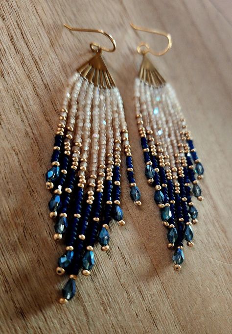 These blue and gold beaded earrings are handmade with high quality glass beads imported from India and have an irridecent sparkle to them. They are finished with gold plated ear wires. Earrings measure 3.5 inches in drop length and weigh 4 grams per earring.  They are  lightweight. Ships within 2 business days of purchase. Beaded Earring Outfits, Diy Ear Wires, Diy Blue Earrings, Blue Beaded Earrings Native American, Beaded Earring Designs, Handmade Bead Earrings, Beaded Earrings Ideas, Diy Earrings Dangle, Earrings Handmade Beaded