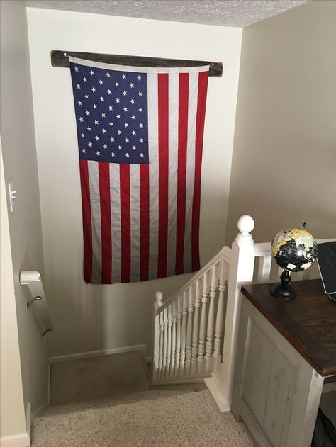 5x8ft American flag on wall vertically in staircase.  Distressed board with 20 gauge shot shells used for pegs. American Flag On Wall, Flag Display Ideas, Anerican Flag, Flag On Wall, Basement Organization, American Flag Wall, Flag Hanging, Flag Display, Photo Room