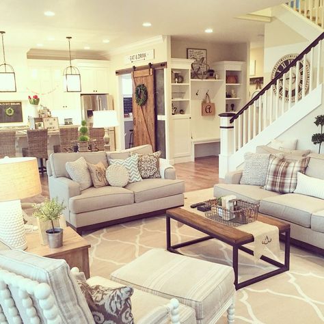 Texture is the key to the neutral color palette in this modern farmhouse. The rustic salvaged wood barn door against the clean white shaker cabinets, a mix of metal, wood, and cozy fabrics in the living room, and pops of freshness in the flowers and topiaries. Interior design by Janna Allbritton of Yellow Prairie Interior Design. Country Farmhouse Living Room, Modern Farmhouse Living Room Decor, Farmhouse Living Room Decor Ideas, Modern Farmhouse Living, Modern Farmhouse Living Room, Farmhouse Living Room, Room Renovation, Farmhouse Decor Living Room, A Living Room