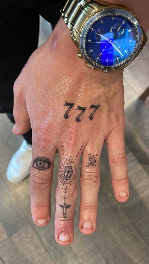 Hand tattoo for men, angel numbers, eye, cross, religious, love, LV Men Angel Number Tattoo, Guys With Hand Tattoos, Angel Numbers Tattoo Men, Lv Hand Tattoo, Religious Hand Tattoo, Angel Number Tattoo Men, Cross Hand Tattoo Men, Number Tattoo Men, Hand Tattoo Men Ideas