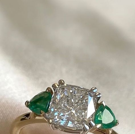 Fenton | Fine Jewellery on Instagram: "Created by sunlight, our Solar Diamonds harness sunshine to create the most sparkling of summer proposals 💍 Framed by rich Emerald accent stones, this stunning cushion cut Solar Diamond Trilogy is sure to get a ‘Yes!’ #gemstonejewellery #finejewellery #trilogyring #emerald #engagementring #summerproposal" Emerald Trilogy Engagement Ring, Trilogy Engagement Ring, Ring Inspiration, Ring Inspo, Emerald And Diamond Ring, Big Jewelry, Cushion Ring, Cushion Cut Diamonds, Emerald Jewelry