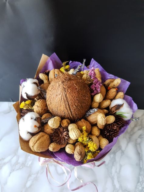 Edible bouquet with coconut, walnuts, peanuts and dried flowers Edible Bouquets, Diy Edible, Fruit Box, Flowers Bouquet, Dried Flowers, Nuts, Bouquets, Peanut, Coconut