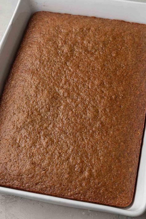 A baked applesauce cake in a white 9x13 baking pan. Gf Applesauce Cake, Applesauce Sheet Cake, Best Applesauce Cake Recipe, Easy Applesauce Cake Recipes, Apple Sauce Cake Mix Recipe, Spice Cake With Applesauce, Vegan Applesauce Cake, Moist Applesauce Cake, Applesauce Cake Mix Recipe