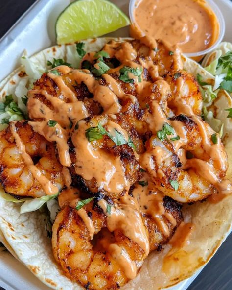 These Bang Bang Shrimp Tacos are an explosion of flavor with a mix of spicy, creamy, and crispy goodness. Perfect for a fun taco night or to impress your guests, this recipe is easy to follow and incredibly delicious. Popcorn Shrimp Tacos With Cabbage Slaw, Baked Shrimp Tacos Oven, Shrimp Taco Toppings, Shrimp Tacos With Lettuce, Seafood Tacos Recipes, Boom Boom Shrimp Tacos, Healthy Bang Bang Shrimp, Mexican Shrimp Tacos, Shrimp Tacos With Cabbage Slaw