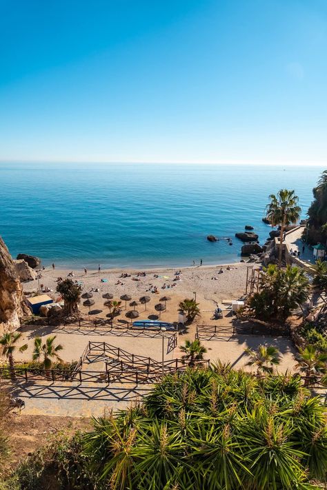 13 Best Beaches in Malaga for Fun Under the Sun Malaga Spain Beach, Malaga Beach, Nerja Spain, Marbella Beach, Malaga Spain, Quiet Beach, Hidden Beach, Places In Europe, Best Beaches