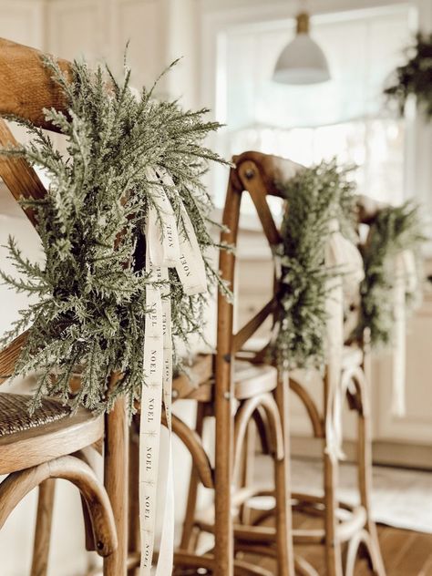 Add festive holiday cheer to your kitchen counter stools with these DIY Christmas chair decorations using small wreaths and Christmas ribbon. It's a simple and elegant way to bring the Christmas spirit into your home, without the fuss of floral wire or command hooks. Chair Decor Christmas, Mini Wreath On Chair, Small Wreath Decor Ideas, Christmas Chair Back Decorations, Wreaths On Bar Stools, Christmas Wreaths In Kitchen, Christmas Bows On Chairs, Wreaths On Chairs Christmas Decor, Bows On Chairs Christmas