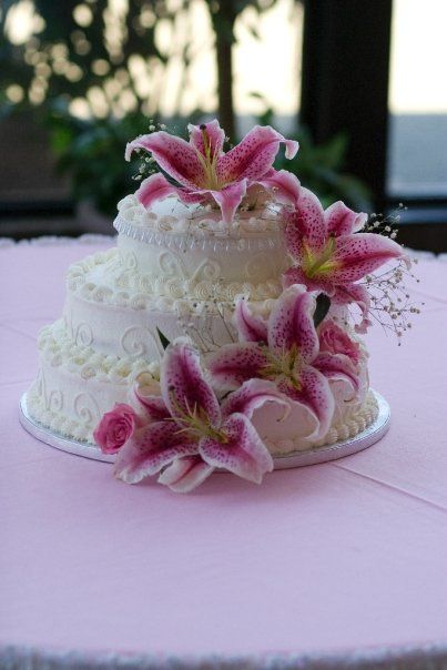 This was our wedding cake. Our colors were inspired by the stargazer lily, my favorite flower. My bouquet and the wedding flowers were stargazers and roses. The church smelled incredible! Wedding Cake With Lilies, Lily Flower Cake, Lily Themed Party, Stargazer Lily Wedding, Lily Wedding Cake, Lily Cake, 13 Birthday Cake, Beach Cakes, Lily Wedding